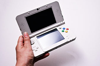Hand Holding White Nintendo 3DS Game Console