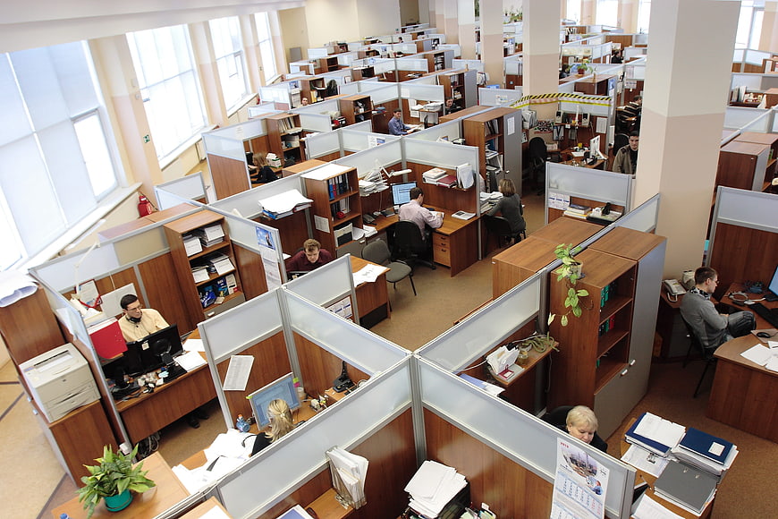 High angle view of busy open plan office with employees working