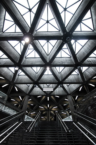 Low angle view of geometric concrete ceiling and stairs