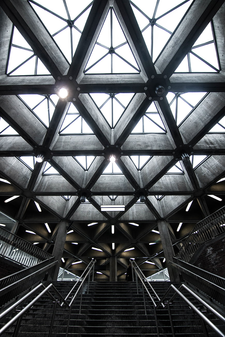 Low angle view of geometric concrete ceiling and stairs