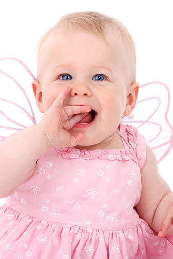 Cute baby girl in pink fairy costume with wings