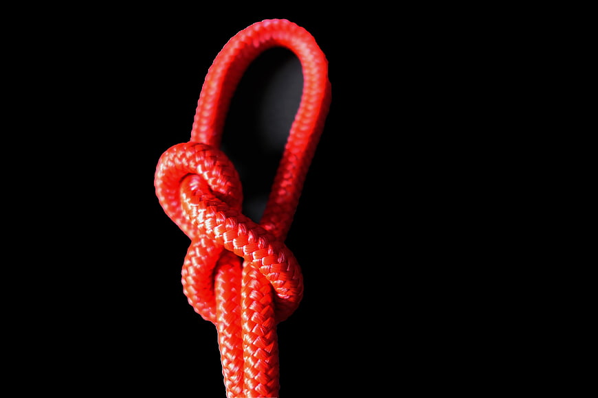 Red Rope Knot on Black Background