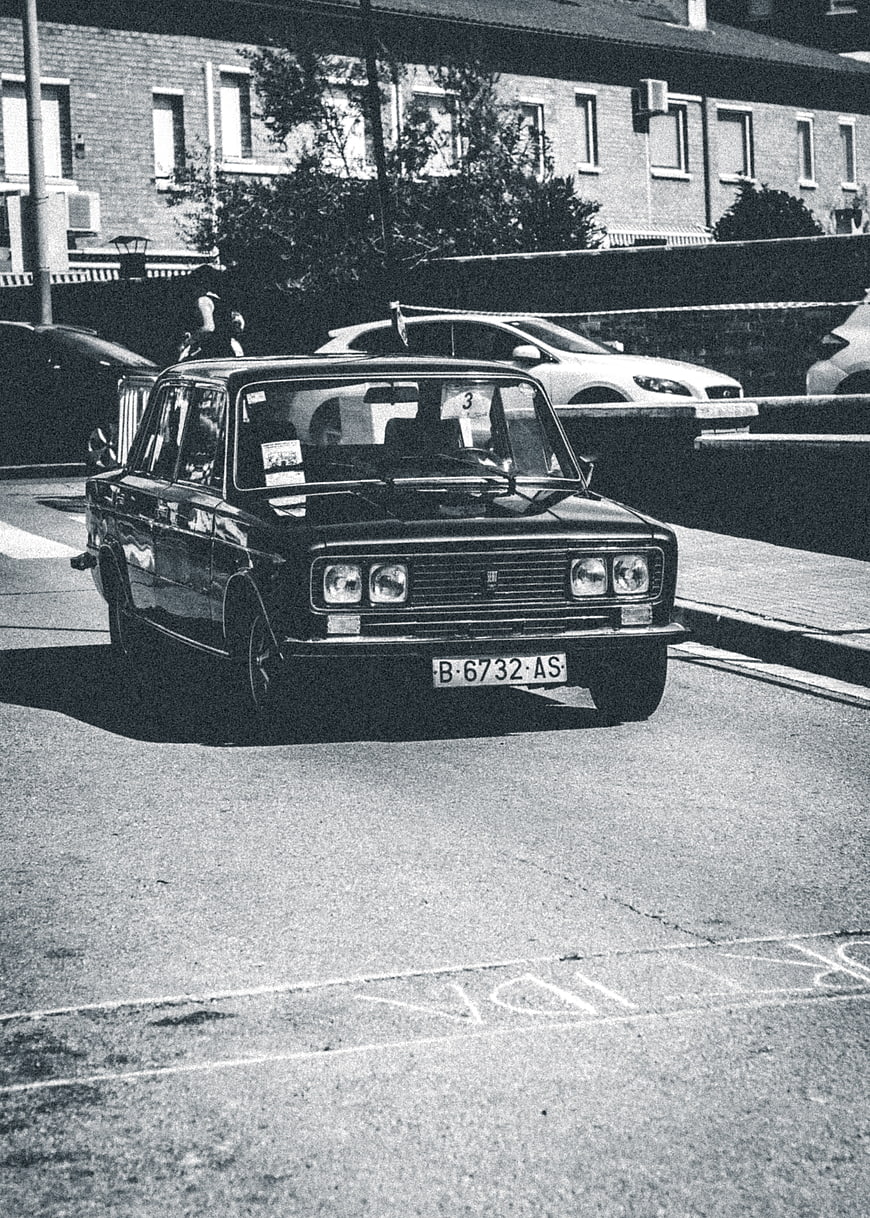 Vintage black car parked on urban street