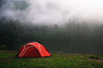 Red Tent Camping by Misty Forest Lake