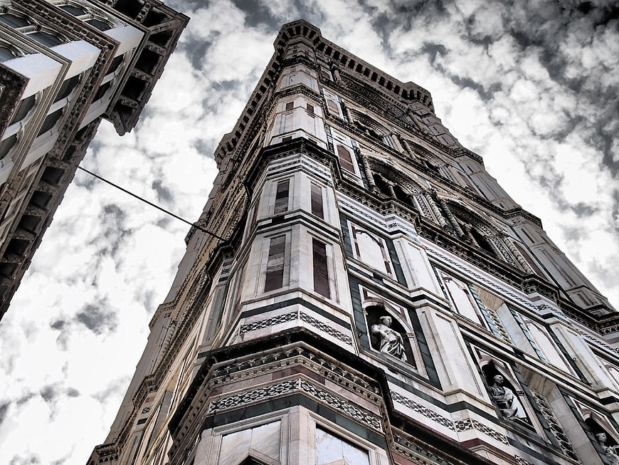 Low angle view of historic Florence church tower facade