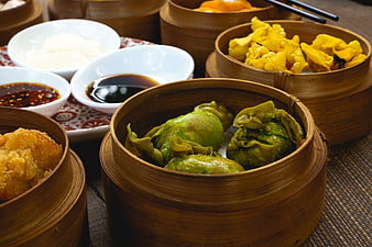 Assorted Chinese Dim Sum in Bamboo Steamers with Dipping Sauces