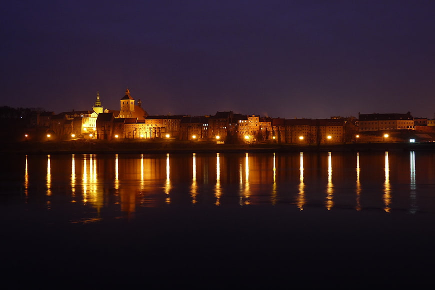 Night View of Grudziądz Old Town Reflected in Vistula River