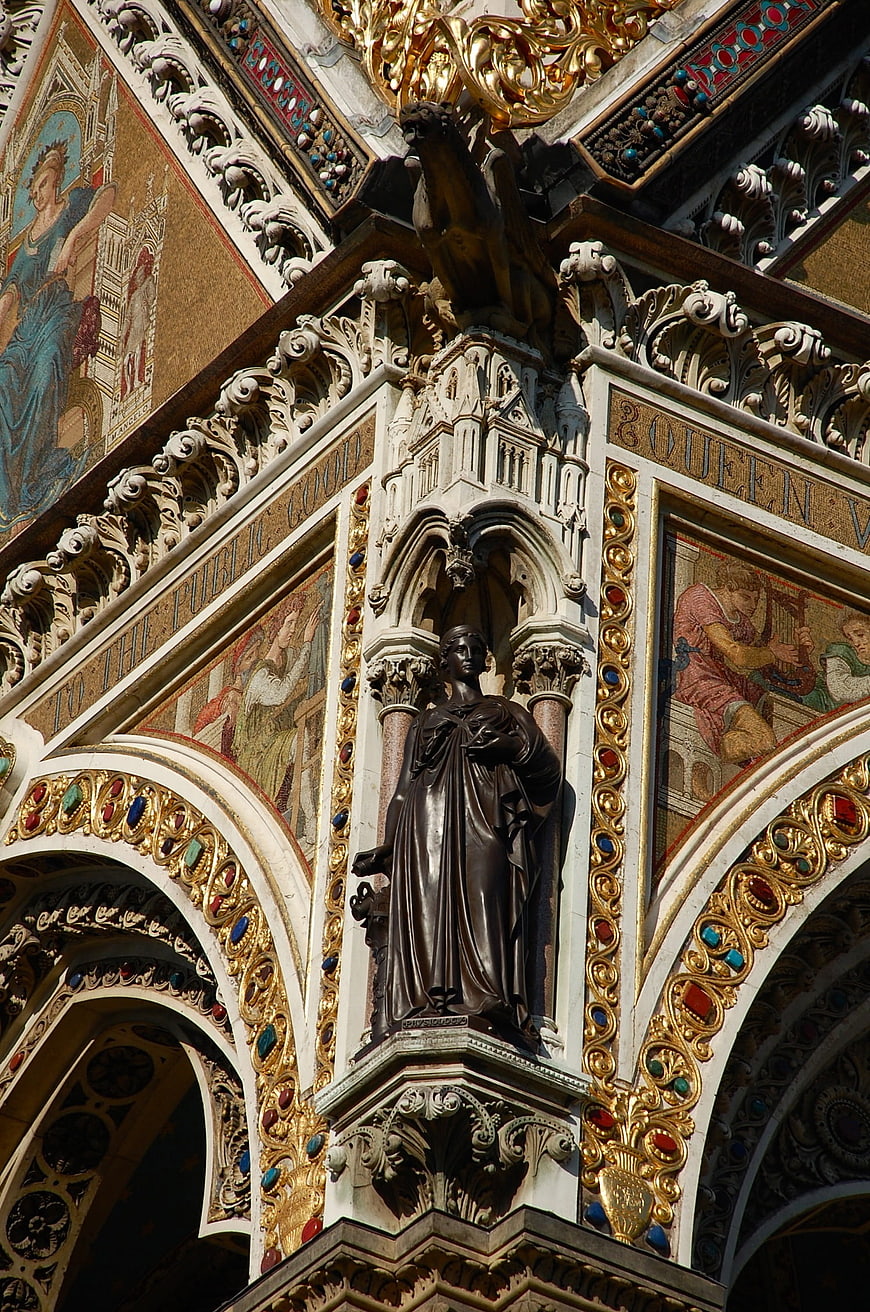 Ornate Gothic Architecture with Gold Mosaics and Bronze Statue