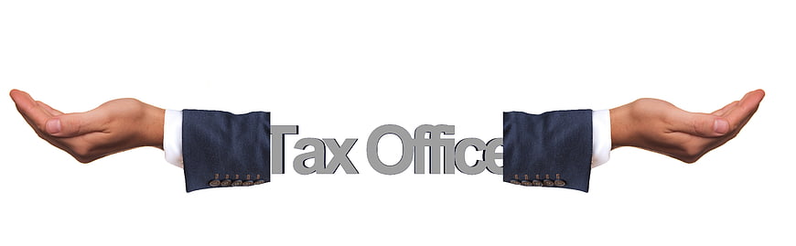 Businessman hands holding Tax Office text on white background