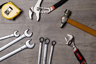 Assorted Hand Tools on Gray Wooden Background