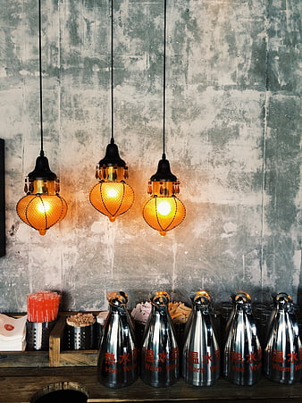 Industrial pendant lights over restaurant condiment station