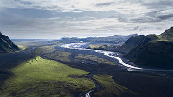 Aerial View of Icelandic River Valley with Green Moss and Black Sand