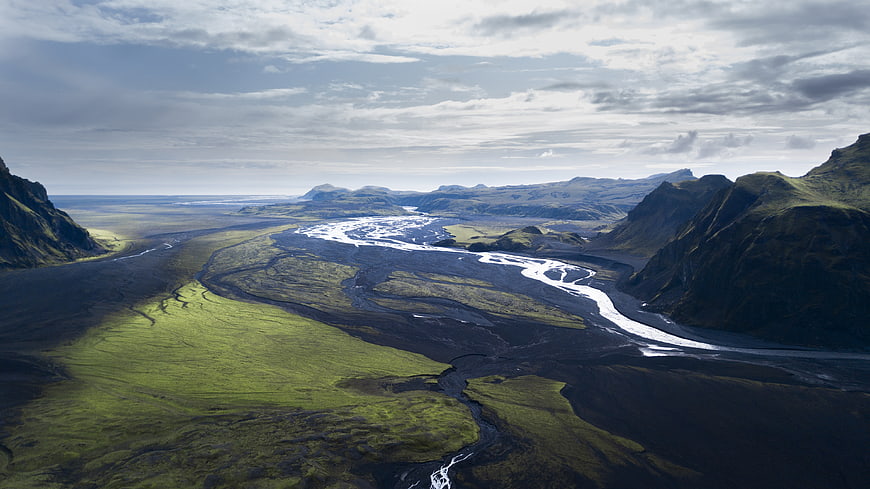 Aerial View of Icelandic River Valley with Green Moss and Black Sand