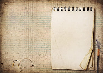 Vintage Notepad With Glasses And Pen On Mathematical Graph Paper