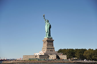 Statue of Liberty full view against clear blue sky