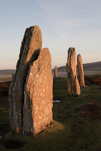 Ancient standing stones in golden hour light, Scotland