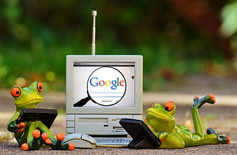 Two Green Frog Figurines Using Vintage Computer And Tablets