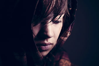 Moody Close-Up of Woman in Plaid Hood