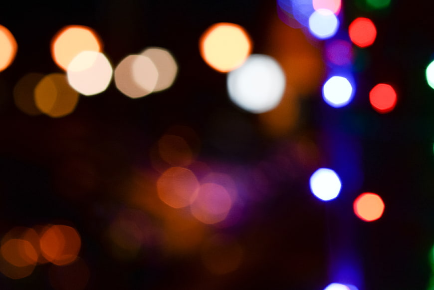 Abstract colorful bokeh lights on dark background