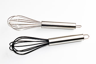 Stainless Steel and Silicone Kitchen Whisks on White Background
