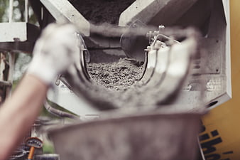 Cement mixer pouring concrete at construction site