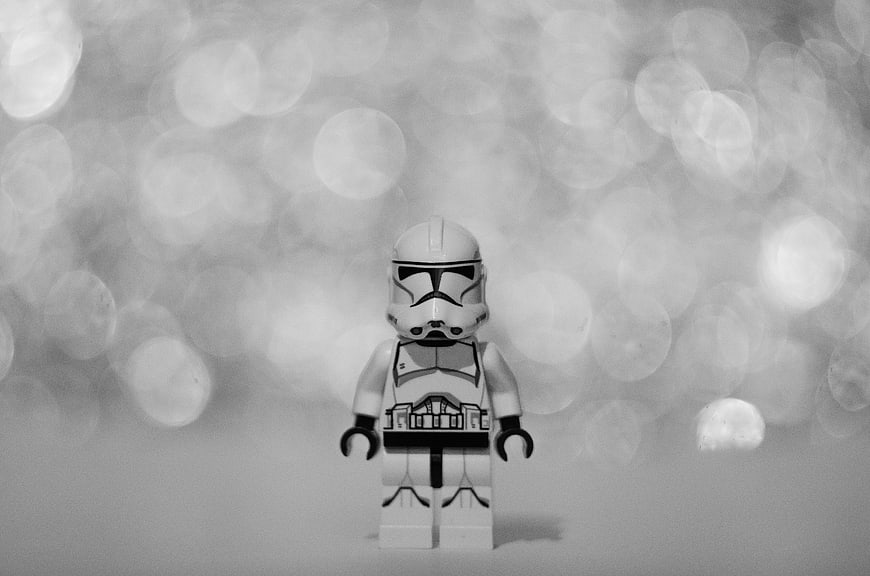 Black and white LEGO Star Wars stormtrooper minifigure with bokeh background