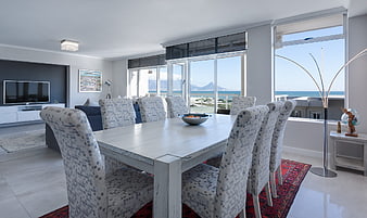 Bright Modern Dining Room With Ocean View And White Furniture