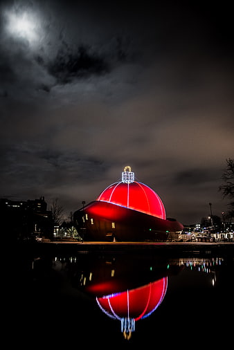 Giant Red Christmas Bauble Light Installation Reflected in Water