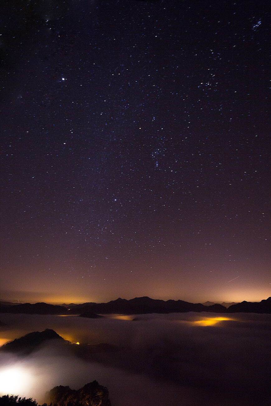 Starry Night Sky Over Mountain Sea of Fog