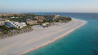 Aerial View of Tropical Beach Resort and Turquoise Ocean