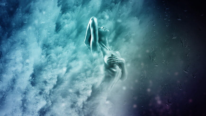 Surreal female figure emerging from swirling blue mist and water