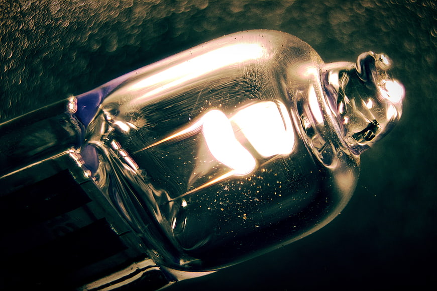 Macro Close-Up of Glowing Vintage Light Bulb Filament