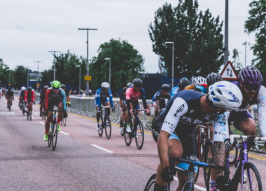 Cyclists racing on a city road during a competitive event