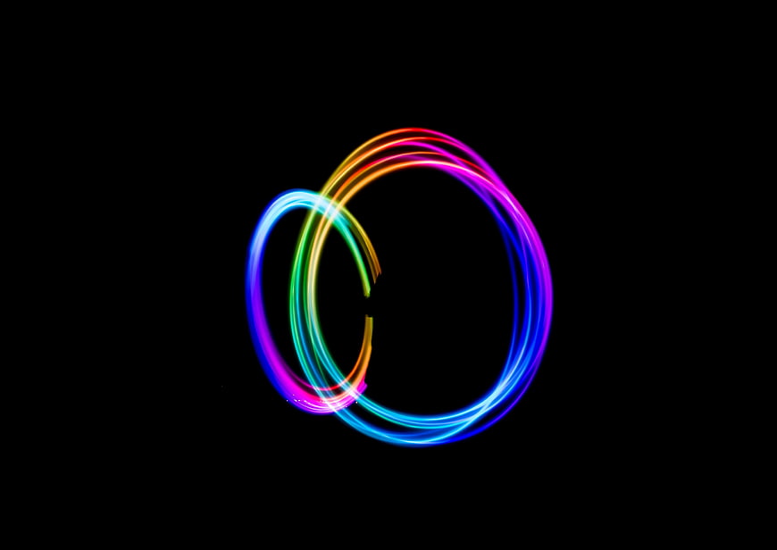 Abstract Rainbow Light Painting Circles on Black Background