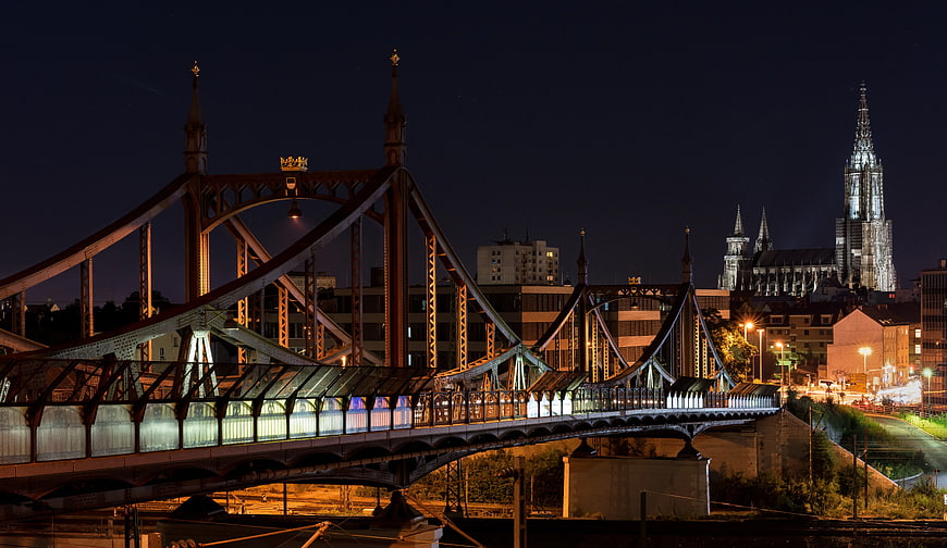 Night View of Iron Bridge and Cathedral in European City