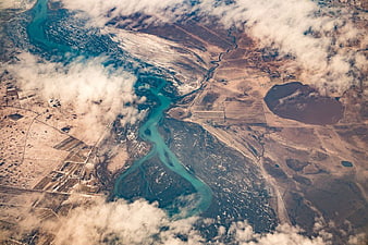 Aerial View of Turquoise River Delta and Arid Landscape