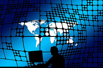 Silhouette of man at computer with global network and earth map background