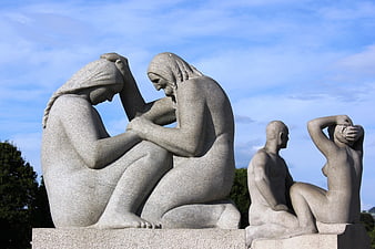 Stone Sculptures of Seated Figures in Oslo Park