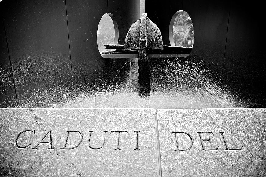 Black and White War Memorial with Water Fountain and Inscription