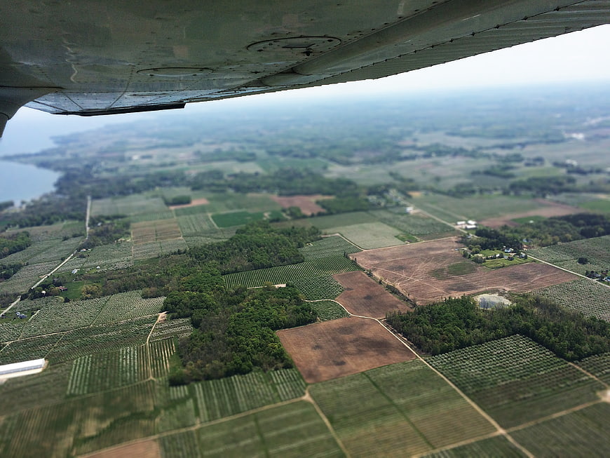 Aerial View of Agricultural Fields from Airplane Window