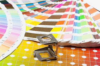 Pantone Color Fan Deck and Thread Counter on Gradient Background