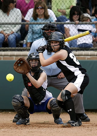Female Softball Batter and Catcher in Action