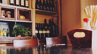 Rustic Bar Interior with Wine Bottles and Wooden Shelves
