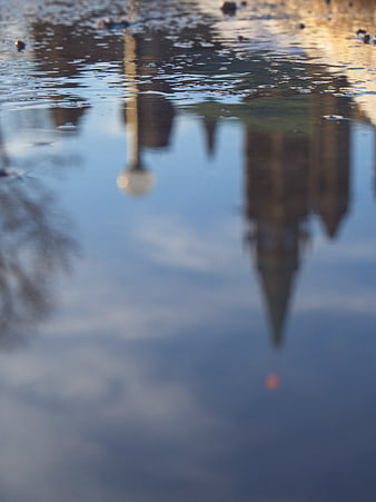 Abstract City Reflection in Rain Puddle