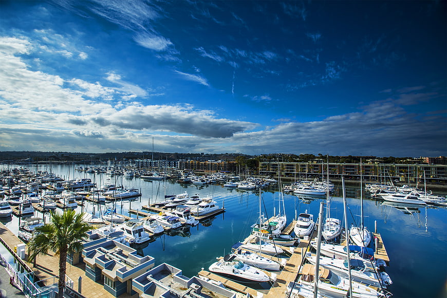 Aerial View of Busy Marina with Boats and Blue Sky