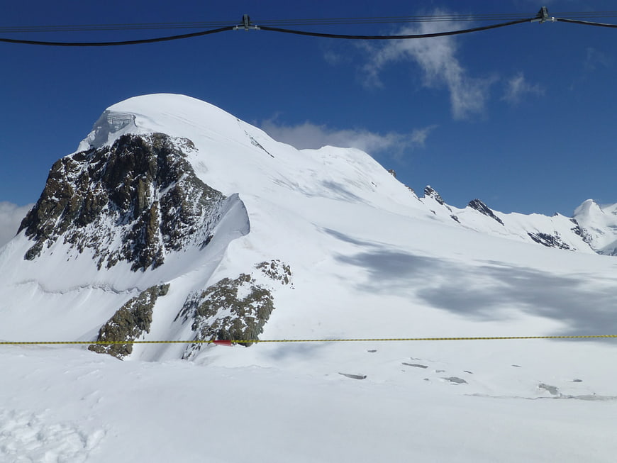 Snowy Breithorn Mountain Peak with Cable Car Lines