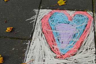 Colorful Chalk Heart Drawing on Sidewalk with Autumn Leaves