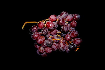 Cluster of Ripe Red Grapes on Black Background