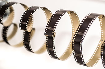 Vintage 8mm film strip arranged in a helix shape