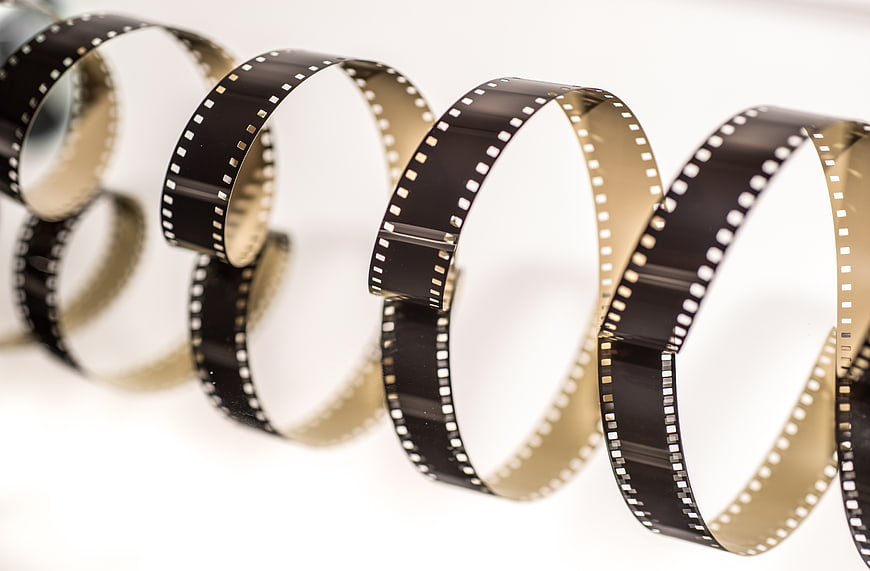 Vintage 8mm film strip arranged in a helix shape